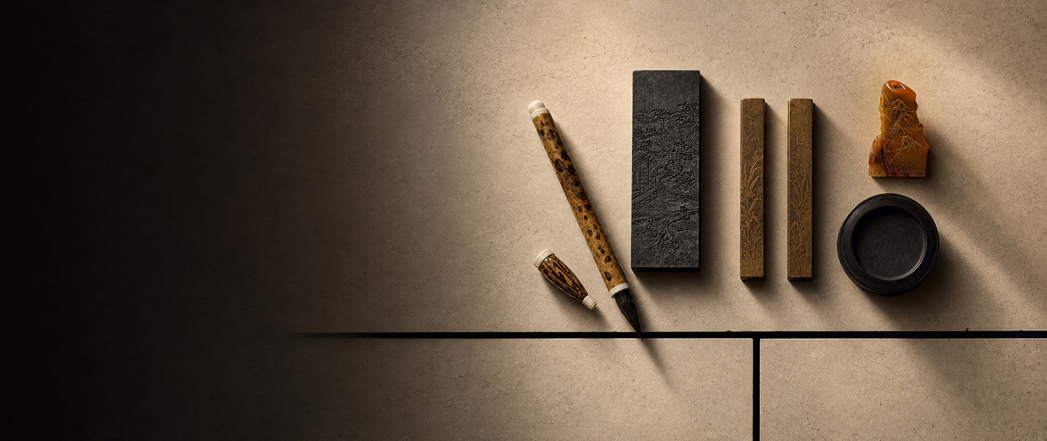 Traditional Chinese calligraphy tools arranged on warm stone